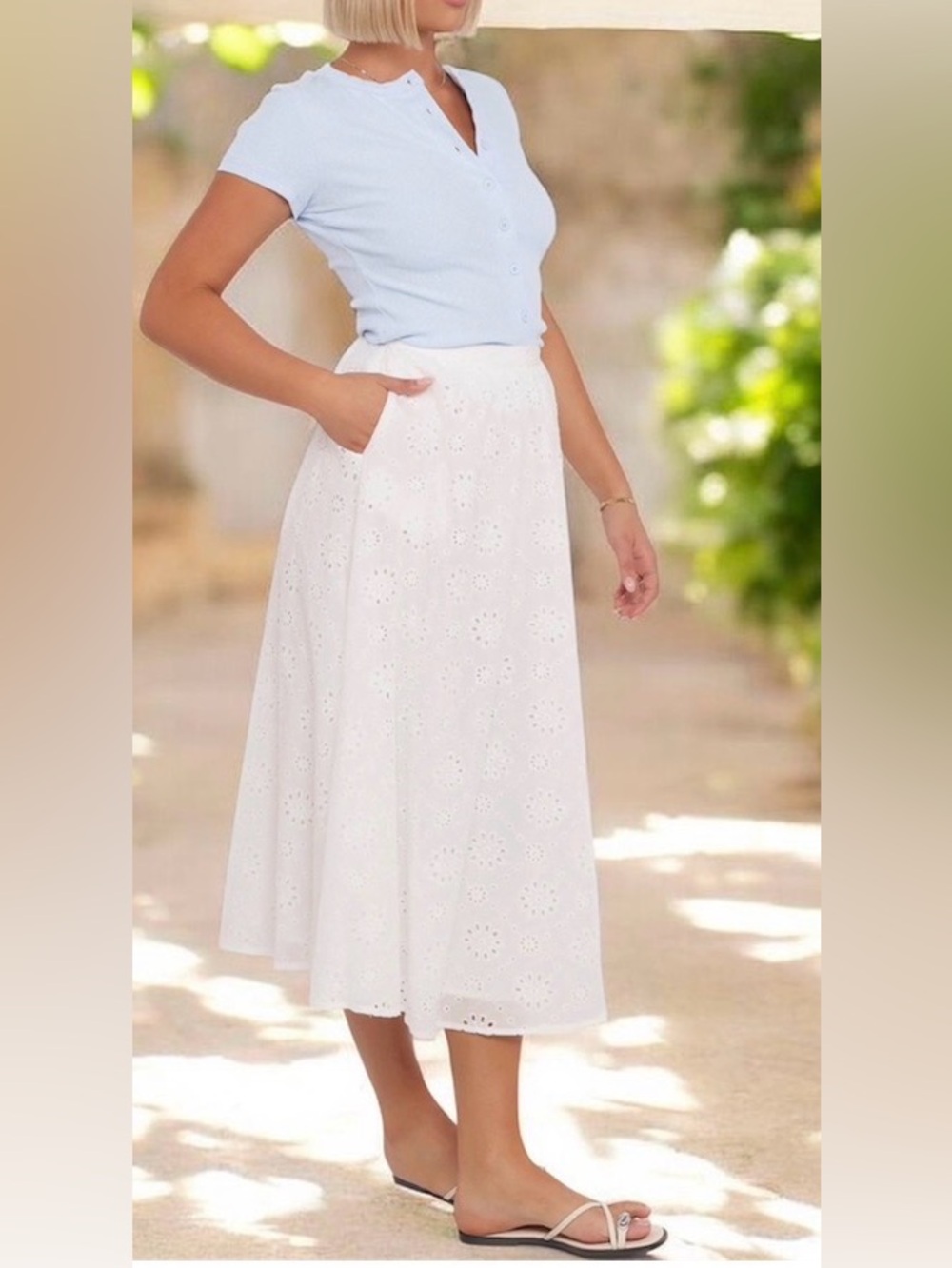 White cotton eyelet lace cotton skirt. Stretchy waist, 2 pockets. Lined. L. NWT